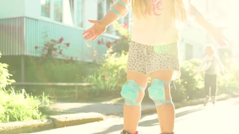 Child learns to ride on roller skates.Summer activities for children. Stock Footage 277719305