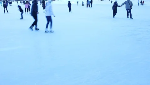 A child learns to skate, winter ice, ice skates Stock Footage 87832699