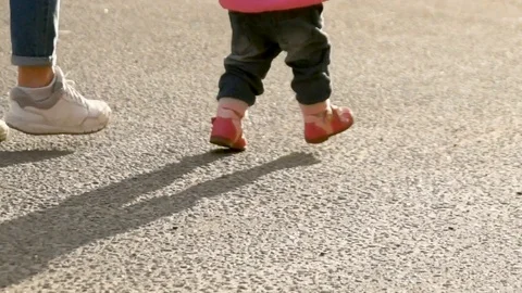 Child learns to walk Stock Footage 117716839