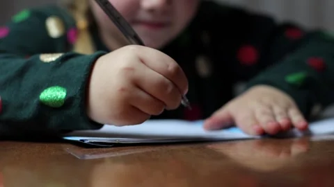 The child learns to write at home, draws a letter. Stock Footage 288581315