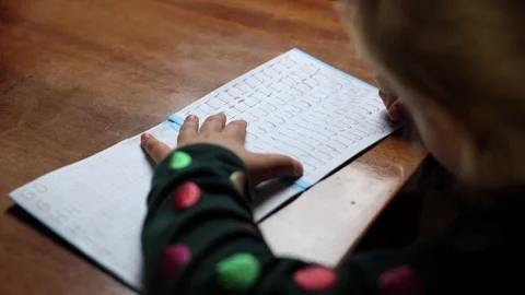 The child learns to write at home, draws a letter. Stock Footage 288581463