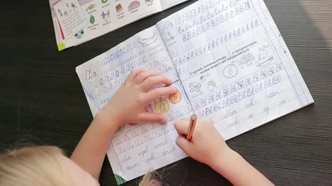 Child learns to write words, learns English Stock Footage 157883289