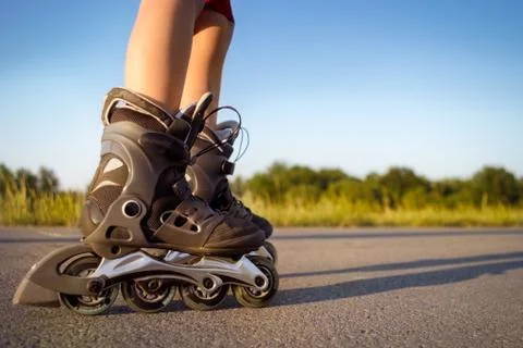 Child  legs in rollers Stock Photos