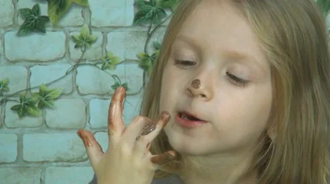 Child Licking Chocolate off Finger, Litt... | Stock Video