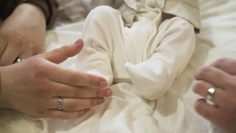 Child lies on the bed Stock Footage 152146297