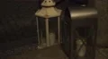 Child is lighting candles and put into grey and white metal lanterns HD Footage