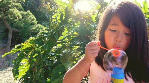 Child Little Girl Blowing Bubbles Stock Footage