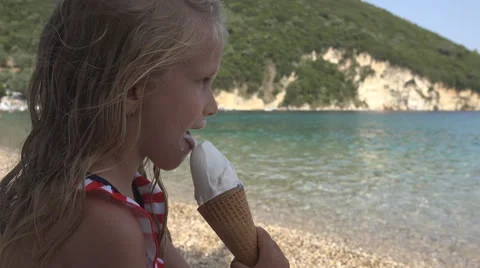 Child, Little Girl Eating Ice Cream Look... | Stock Video | Pond5