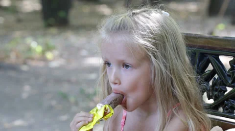 Child, Little Girl Eating, Licking Ice C... | Stock Video