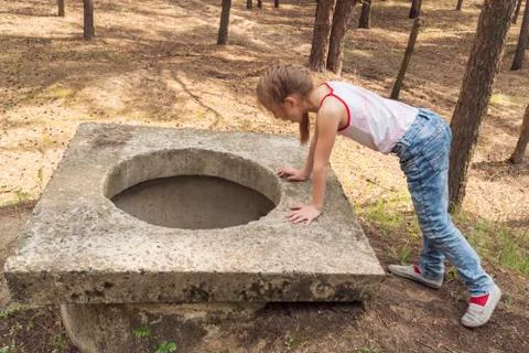 Child looked into the open hatch Stock Photos