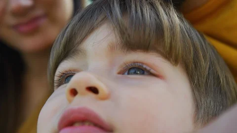 Child looking up and smiling Stock Footage 100003281