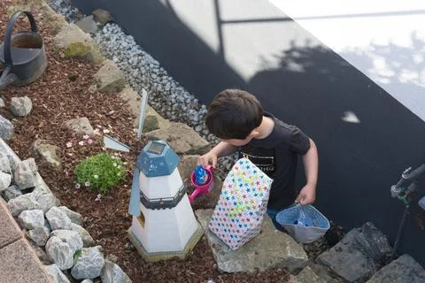 A child looking for Easter egg in the garden Stock Photos