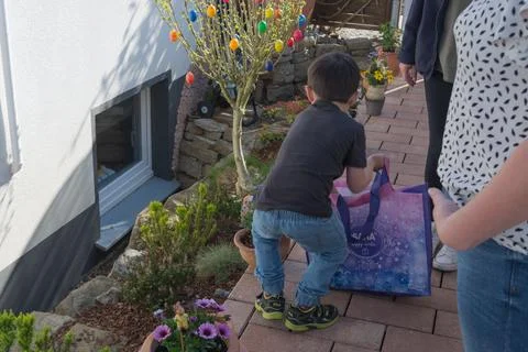 A child looking for Easter egg in the garden Stock Photos