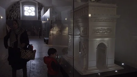 Child looking miniature model of Arc dr Triomphe inside interior monument Paris Stock Footage 93812434