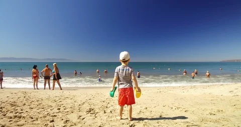 Child looking at the ocean.  Stock Footage 102690004