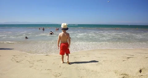 Child looking at the ocean.  Stock Footage 102690151