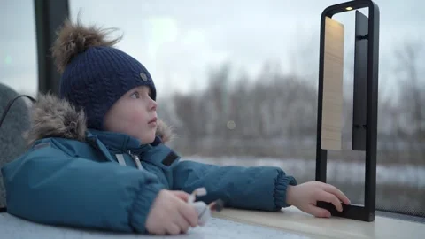 Child looking out the window of a moving river ship. Stock Footage 327065356