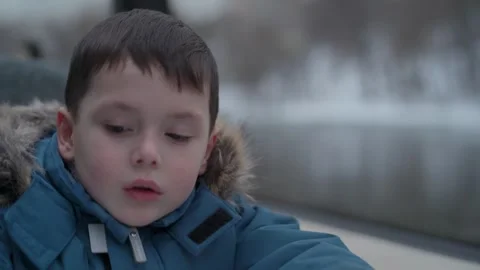 Child looking out the window of a moving river ship. Stock Footage 327481155