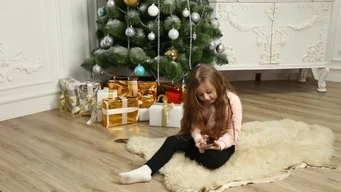 Child looking at phone Stock Footage 71680024