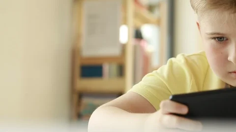  Child looking at a smart phone.  Stock Footage 109417259