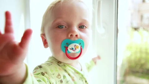 The child looks at the camera Stock Footage 130381214