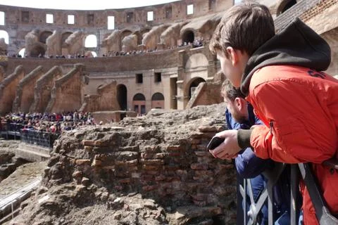 Child looks at the coliseum Stock Photos
