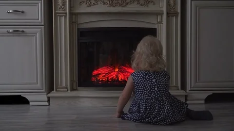 Child looks at fire Stock Footage 72571845