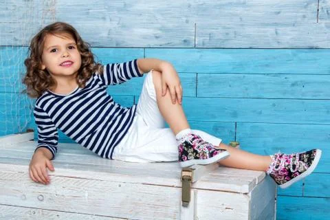 Child is lying on the dower chest Stock Photos