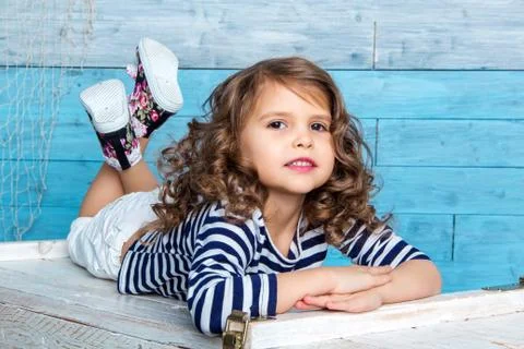 Child is lying on the dower chest Stock Photos