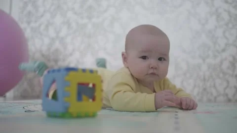 The child is lying on the floor Stock Footage 267835408