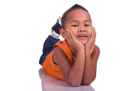 Child lying on the ground looking Stock Photos