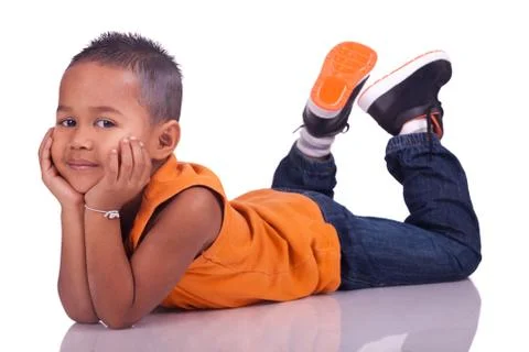Child lying on the ground looking Stock Photos
