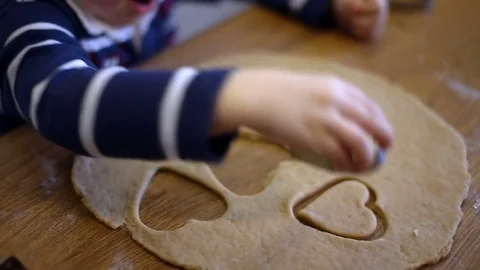 Child makes biscuits for baking Stock Footage 74403212