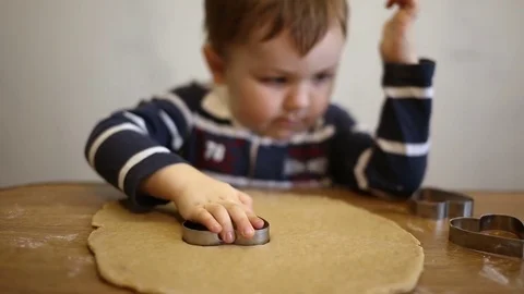 Child makes biscuits for baking Stock Footage 74404034