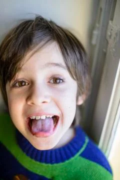 Child makes grimaces Stock Photos