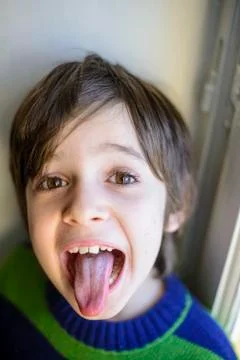 Child makes grimaces Stock Photos