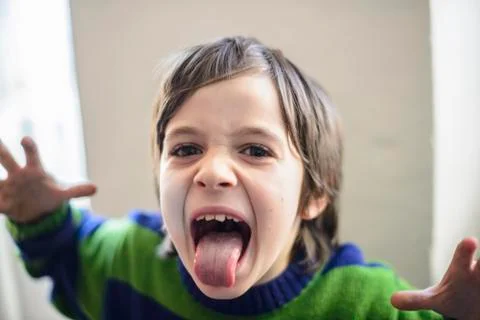 Child makes grimaces Stock Photos