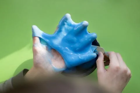 The child makes slime. Selective focus Stock Photos