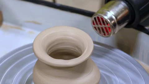Child making ceramic vase on rotating pottery wheel at workshop. Creativity. Stock Footage 305062324