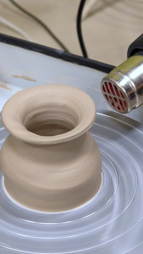 Child making ceramic vase on rotating pottery wheel at workshop. Creativity. Stock Footage 305150091