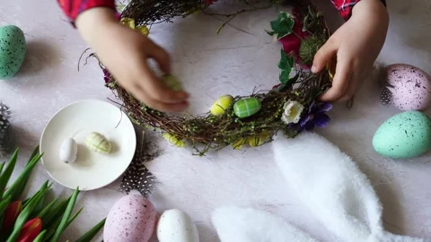 Child making Easter composition wreath. Spring Easter holiday Stock Footage 260714367