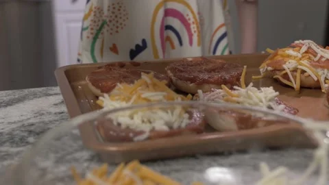 Child making mini pizzas - 4k Stock Footage 170907318