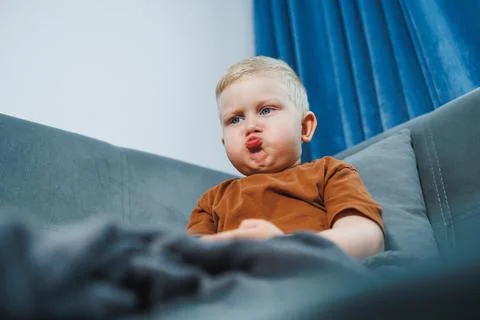 Child making silly face. Young child with playful expression. Infant pouting  Stock Photos