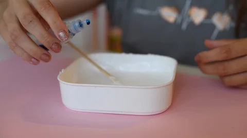 Child making slime himsel - step by step guide. Stock Footage 111879148