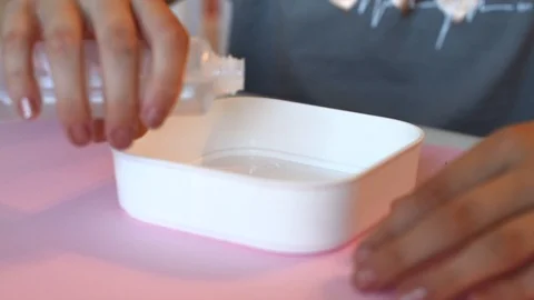 Child making slime - step by step guide. playing with slime. Stock Footage 111892566