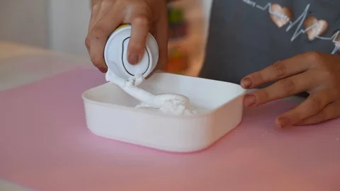 Child making slime - step by step guide. playing with slime. Stock Footage 111892611