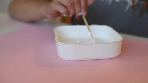 Child making slime - step by step guide. playing with slime. Stock Footage 111892633