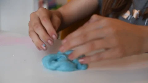 Child making slime - step by step guide. playing with slime. Stock Footage 111892704