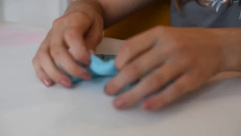 Child making slime - step by step guide. playing with slime. Stock Footage 111892782