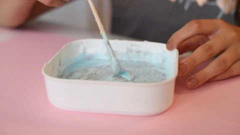 Child making slime - step by step guide. playing with slime. Stock Footage 111892803